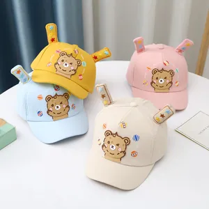 Cute baby cartoon baseball caps in yellow, blue, pink and beige with 3D ears