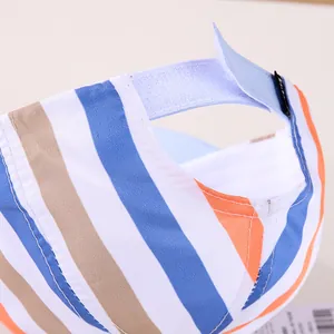 Detail of multi-color striped kids baseball cap with adjustable Velcro strap closure