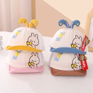 Detail of mesh baby baseball caps with cute bunny ears and soft embroidery in four colors