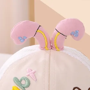 Close-up of baby sun hat with breathable mesh, cute 3D ears, and detailed embroidery