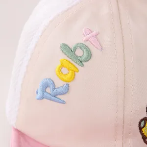 Detail of pink mesh baby hat with colorful Rabt embroidery and breathable texture
