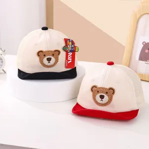 Detail view of baby mesh baseball hats with cute bear embroidery and breathable structure