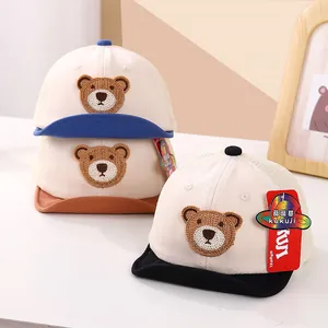 Detailed view of breathable mesh baby baseball caps with cute bear embroidery in three colors