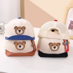 Detail of baby mesh baseball cap with cute bear patch and breathable summer fabric