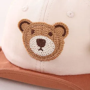 Cute baby sun hat with bear patch and soft brown brim for summer protection