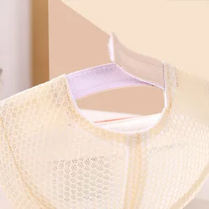 Detail of adjustable hook-and-loop strap on breathable mesh baby baseball cap