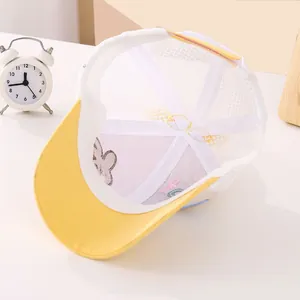 Close-up of breathable white mesh and sweatband detail on the yellow baby sun hat