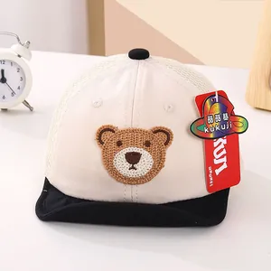 Close-up of baby mesh baseball cap with woven bear patch and breathable back design