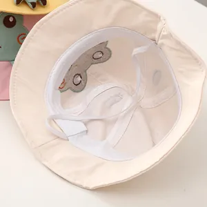 Chapeau bob bébé blanc cassé avec broderie grenouille et cordon de serrage doux