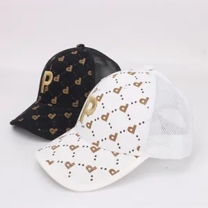 Close-up of kids mesh trucker hats with P letter embroidery and printed patterns