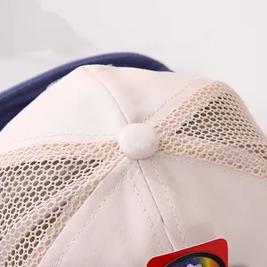 Macro detail of breathable mesh fabric and reinforced stitching on toddler summer cap