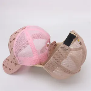Detail view of pink mesh baseball cap with P-pattern and adjustable strap