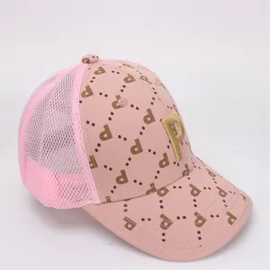 Side view of pink kids baseball mesh cap with golden 3D embroidered P and polka dot pattern
