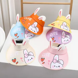 Detail view of multi-color cartoon rabbit sun hats with 3D ears and CUTE print