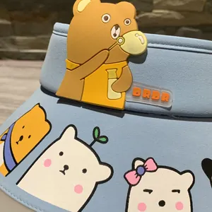 Detail of light blue sun visor featuring a 3D rubber cartoon bear and DRDR logo