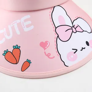 Detail of pink toddler sun hat showing cute white bunny, carrot patterns and CUTE text