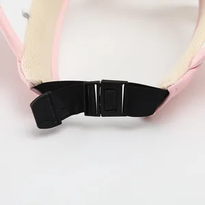 Detail of pink sun hat with adjustable plastic buckle and breathable beige mesh lining