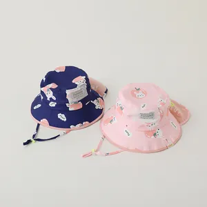 Detailed view of kids sun hats with rabbit peach print and protective neck flap