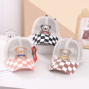 Detailed view of three breathable mesh kids baseball caps with bear embroidery and checkers
