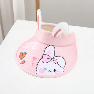 Detail of pink sun visor hat with cute bunny ears and cartoon carrot embroidery