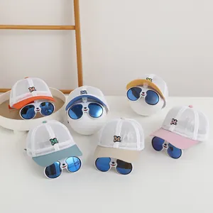 Detail of multi-color kids mesh baseball caps with built-in flip sunglasses and M embroidery