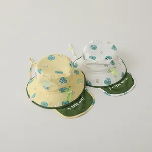 Detail of baby sun hats with neck flaps, cartoon frog prints and adjustable windproof cords