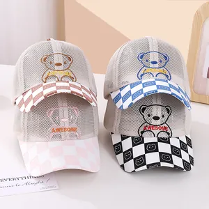 Detailed view of four breathable mesh baseball caps for kids with cartoon bear embroidery
