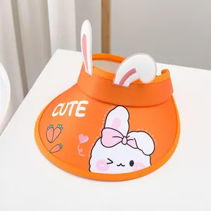 Close-up of orange kids sun hat with 3D bunny ears and white CUTE print detail
