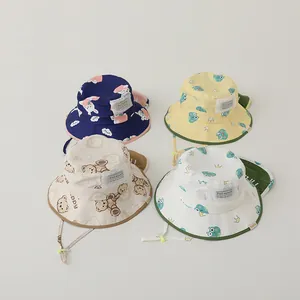 Flat lay of colorful toddler sun hats with cute animal patterns and adjustable chin straps