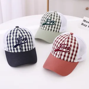 Detailed view of kids mesh trucker hats with Frog embroidery and plaid pattern fabric