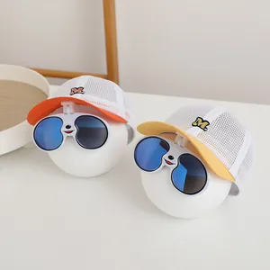 Detail view of breathable kids' mesh cap with integrated smiley sunglasses on the brim
