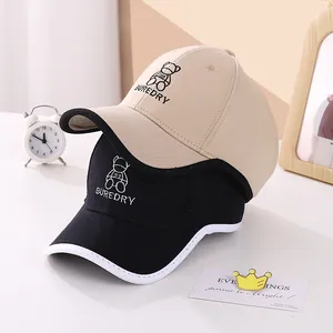 Kids baseball caps with bear embroidery and open top design in beige and black colors