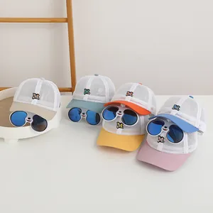Detail view of four breathable mesh kid baseball caps with creative animal sunglasses