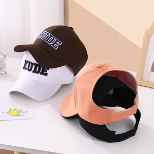Detail view of multi-color baseball caps with KUDE embroidery and adjustable metal buckle