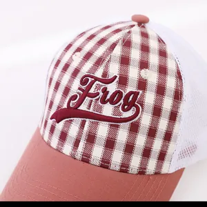 Detail of Frog embroidery on mesh baseball cap with red white plaid pattern