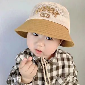 Kids summer bucket hat with breathable mesh top and HONGK 1997 embroidery detail