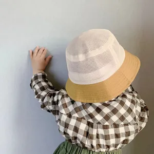 Rear view of breathable kids mesh bucket hat with yellow brim and white ventilated crown