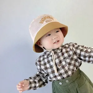 Detail of baby summer sun hat featuring breathable mesh top and HONGK 1997 embroidery