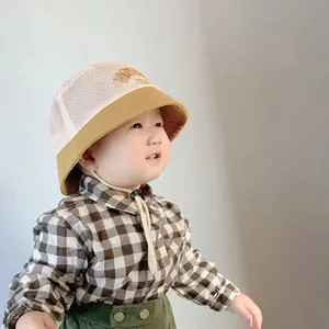Detail of breathable mesh kids sun hat with adjustable strap and HONEY embroidery