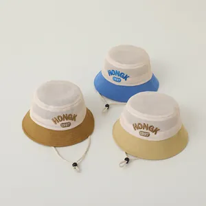 Close-up of breathable mesh sun hats with HONGK 1997 embroidery and adjustable chin straps
