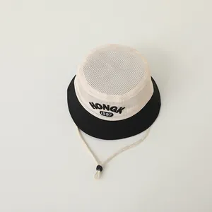 Close-up of kids sun hat featuring breathable mesh top and HONGK 1997 embroidery