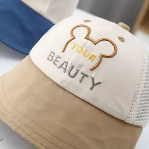 Detailed macro view of children's breathable mesh baseball cap with premium embroidery