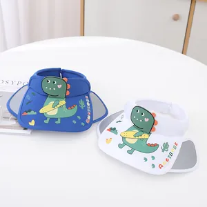 Detail of blue and white kids sun visors with cartoon dinosaurs and side expansion flaps
