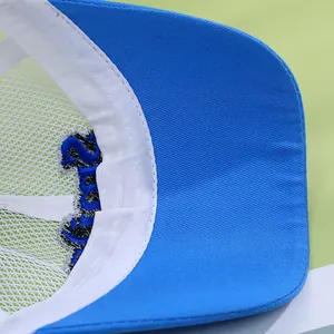 Close-up of blue cotton brim and white breathable mesh on children's baseball cap