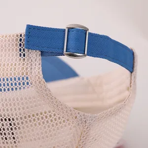 Detail of breathable mesh fabric and adjustable metal buckle on baby baseball cap