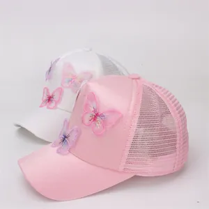 Detail of pink and white butterfly embroidery on breathable mesh kids baseball cap