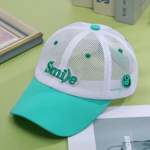 Detail of breathable white mesh on mint green kids baseball cap with Smile embroidery