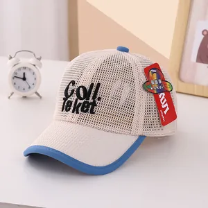 Detail of breathable mesh baby baseball cap with Coll embroidery and blue brim detail