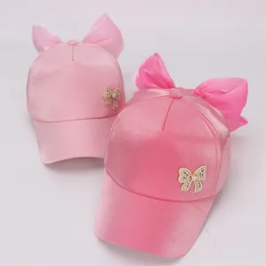 Cute girls satin baseball caps in pink and rose pink with oversized organza bows
