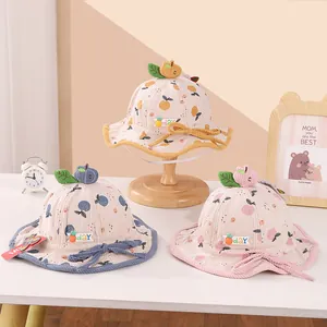 Detailed corduroy texture of toddler bucket hats with 3D fruit stems and floral print